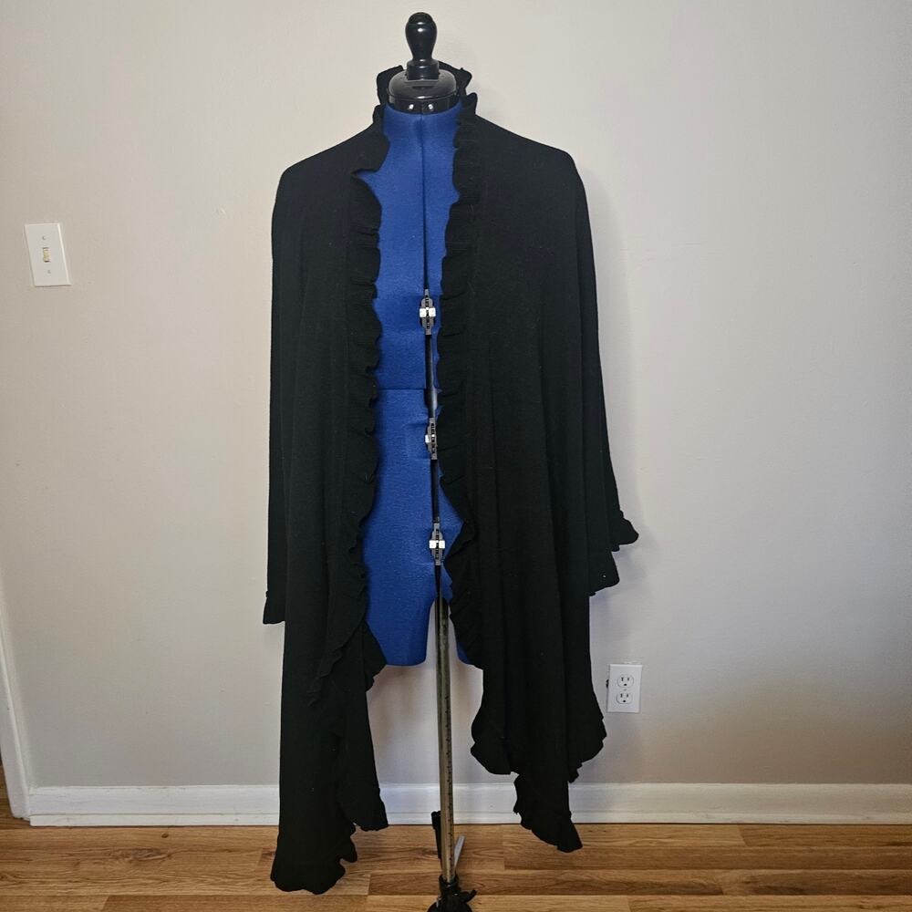 Nina Leonard wool knit shawl cape with ruffled trim.